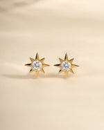 Gold starburst earrings by Sami Jewels featuring a radiant, sunburst design with intricate detailing.