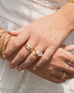 Gold Starburst Ring by Sami Jewels styled on a model, showcasing its intricate design and radiant starburst pattern.