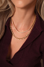 Gold Sami Jewels Statement Pavé Necklace worn by a model, featuring sparkling pavé stones and bold design.