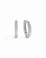 Sterling silver 11mm studded huggie hoop earring white background