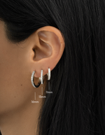 sterling silver 11mm, 13mm, and 16mm studded huggie hoop on womens ear 