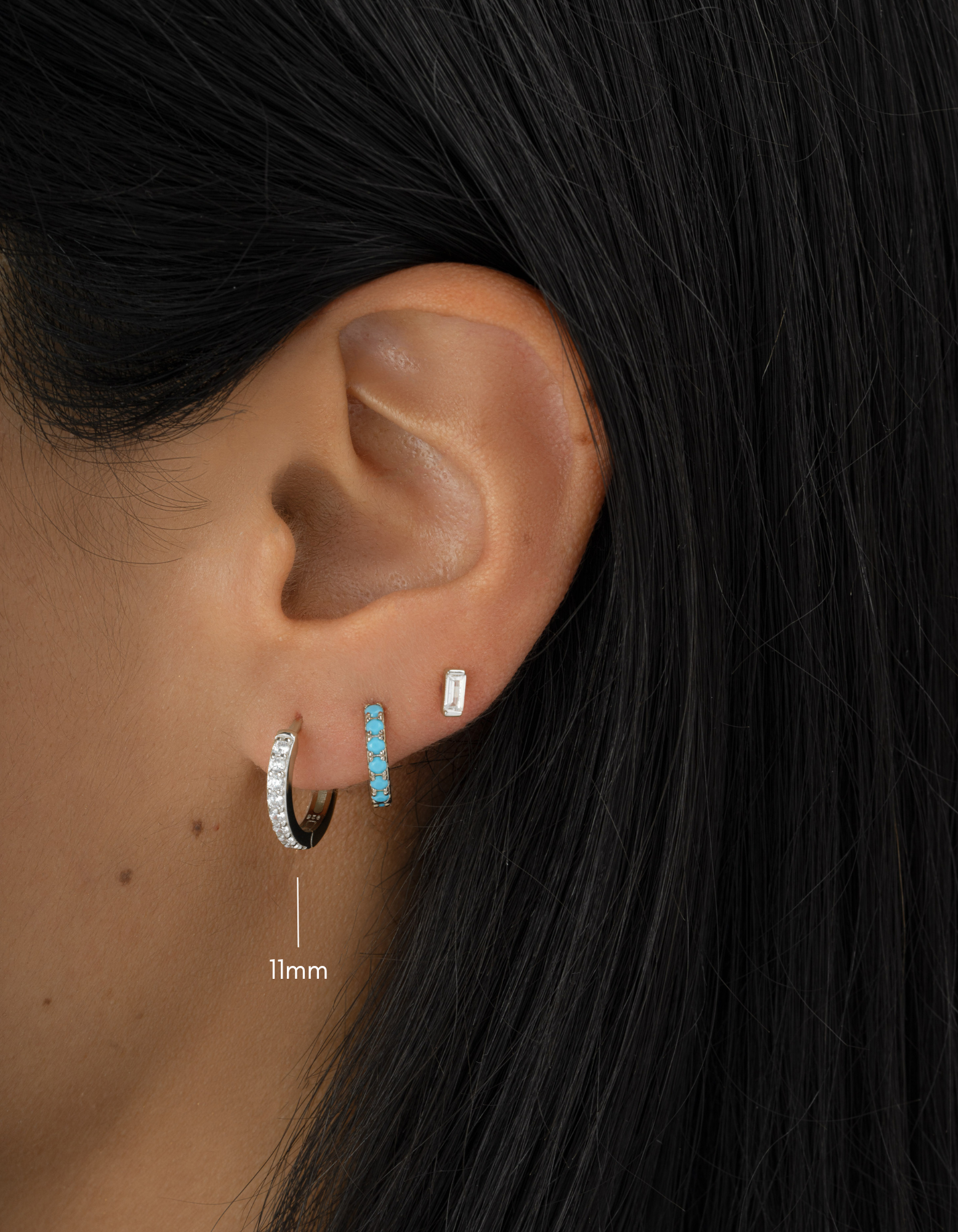 sterling silver 11m studded huggie earring diamond earring stack with a turquoise, huggie, on womens ear