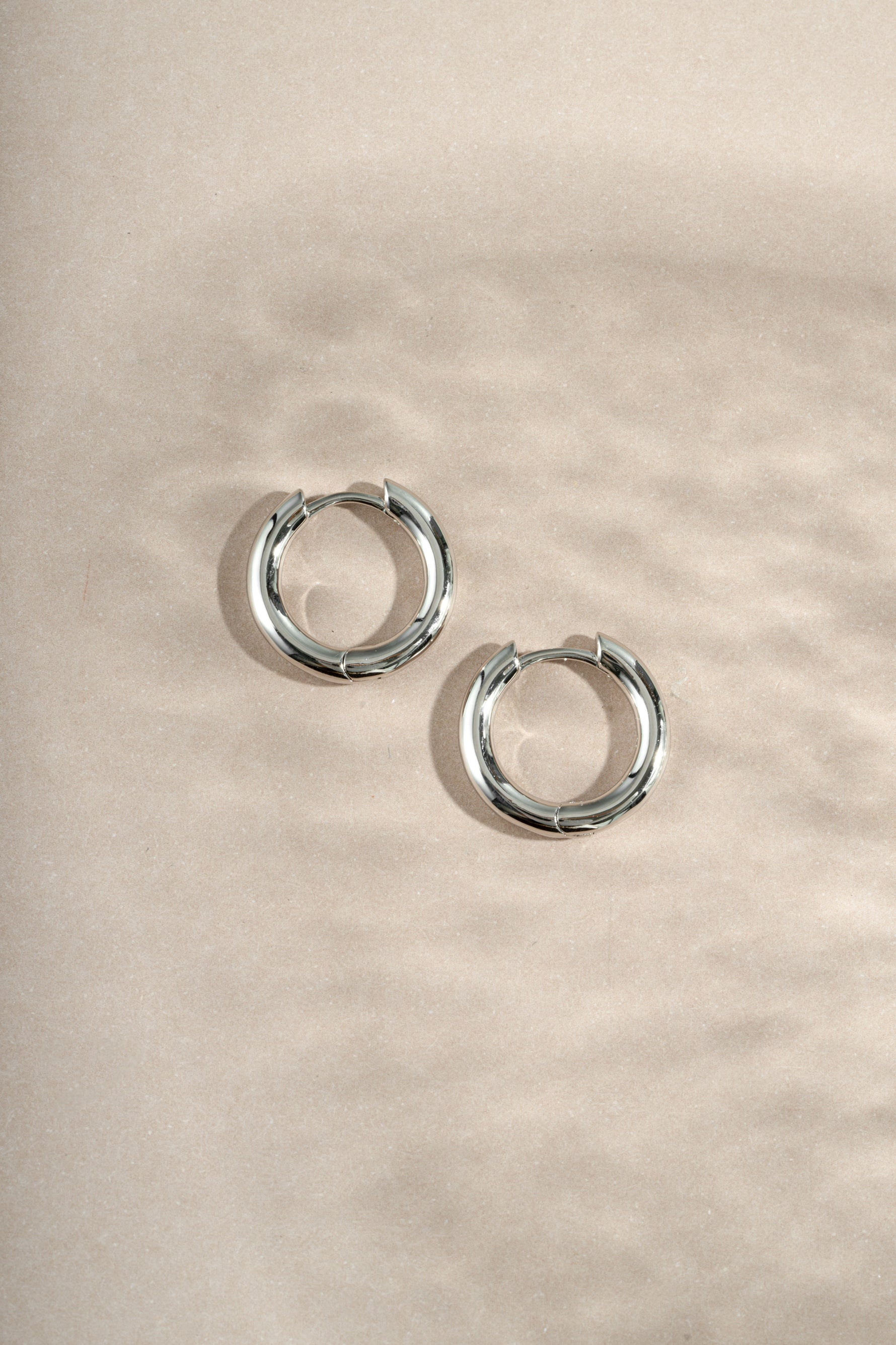 sterling silver hoop earrings neutral background
