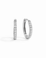 Sterling silver 13mm studded huggie hoop earring white background