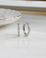 sterling silver 13mm studded huggie hoop plain background