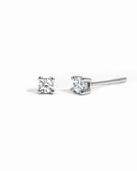sterling silver diamond solitaire stud earrings white background