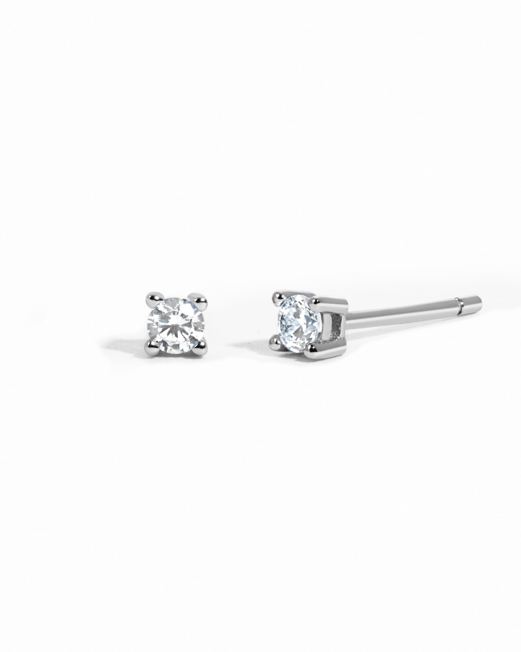 sterling silver diamond solitaire stud earrings white background