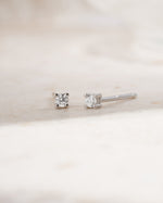 Sterling silver 2mm solitaire stud earrings  side view on white background
