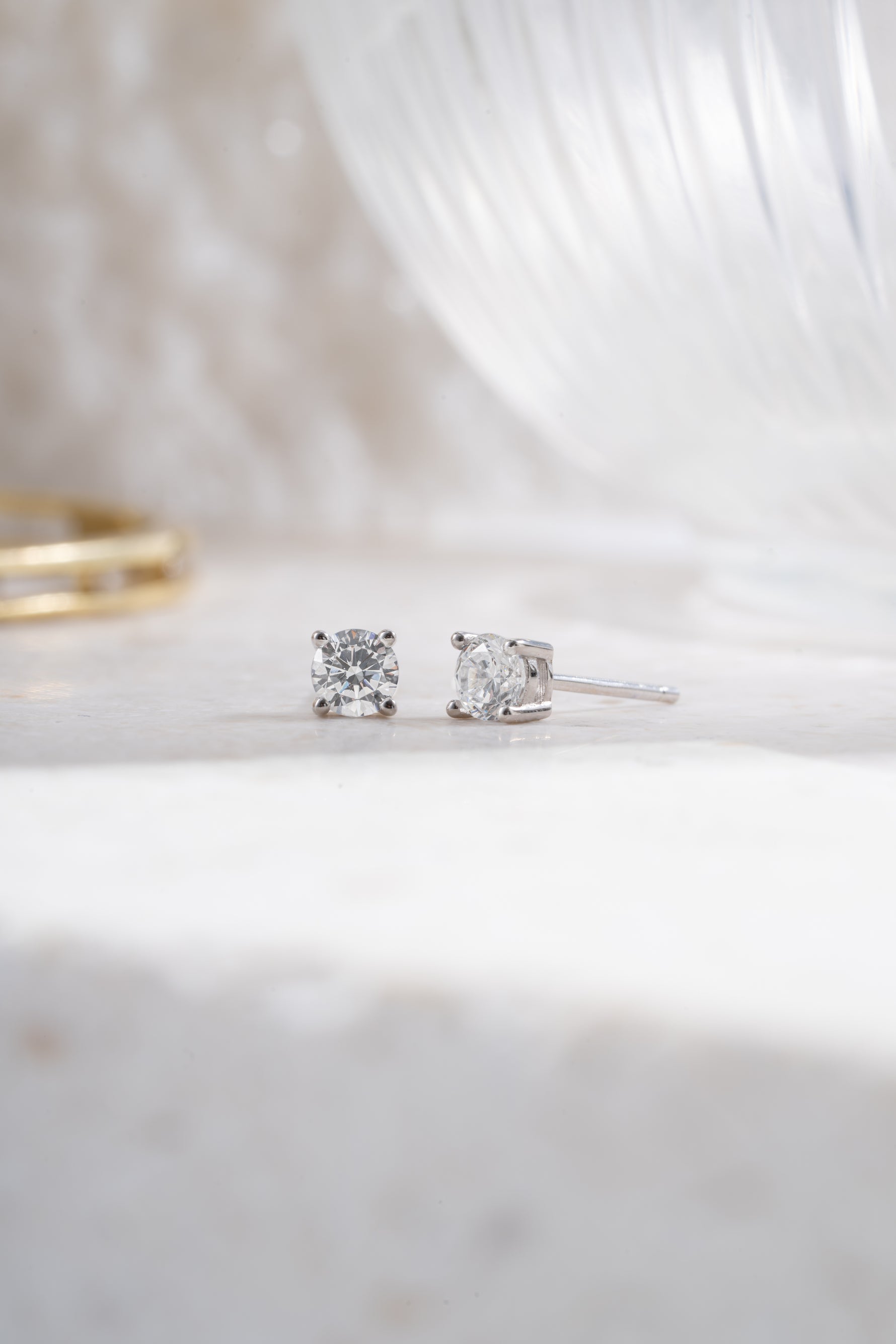 sterling silver 4mm solitaire stud earrings angled 