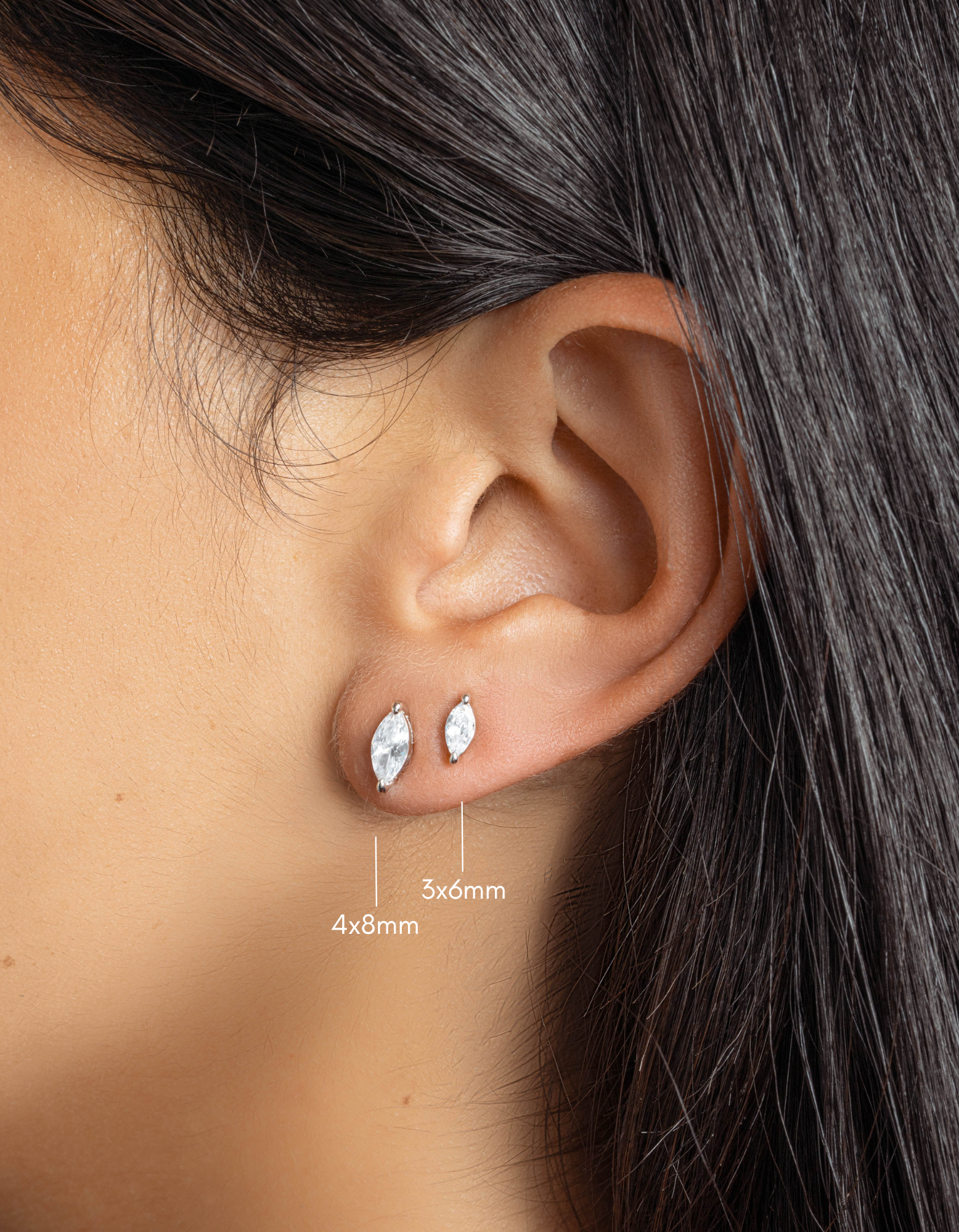 sterling silver 4x8mm marquise cut stud earrings and 3x6mm marquise cut stud earrings on womens ear