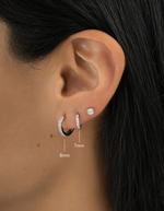 sterling silver 8mm studded huggie and 7mm studded huggie earring stack model image