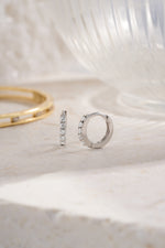 sterling silver 7mm diamond studded huggie plain background