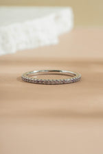 sterling silver alexandrite eternity ring neutral background