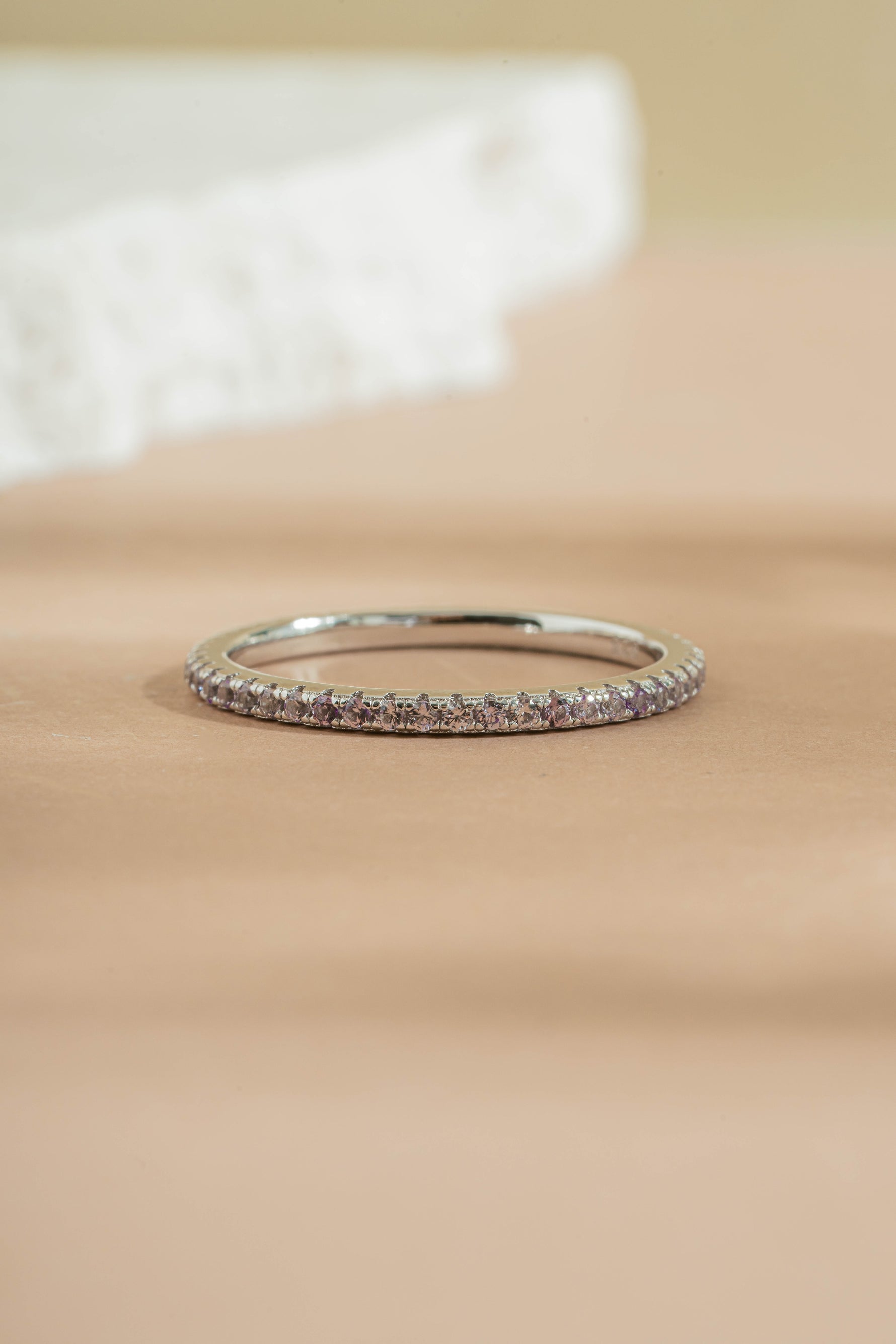 sterling silver alexandrite eternity ring neutral background