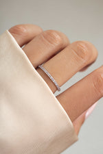 sterling silver alexandrite eternity ring on womens hand