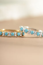 gold and sterling silver turquoise and opal stacking ring closeup