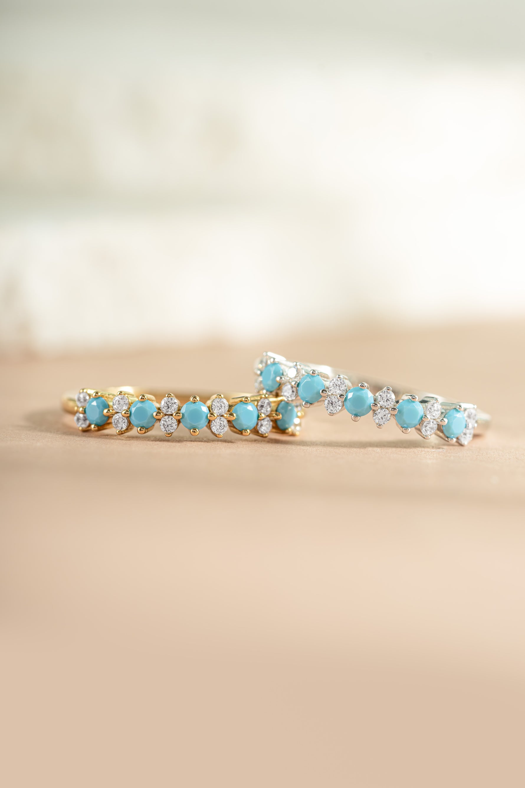 gold and sterling silver turquoise and opal stacking ring neutral background 