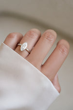 Sterling silver bezel marquise ring from Sami Jewels worn on a hand, showcasing elegant jewelry design and craftsmanship.