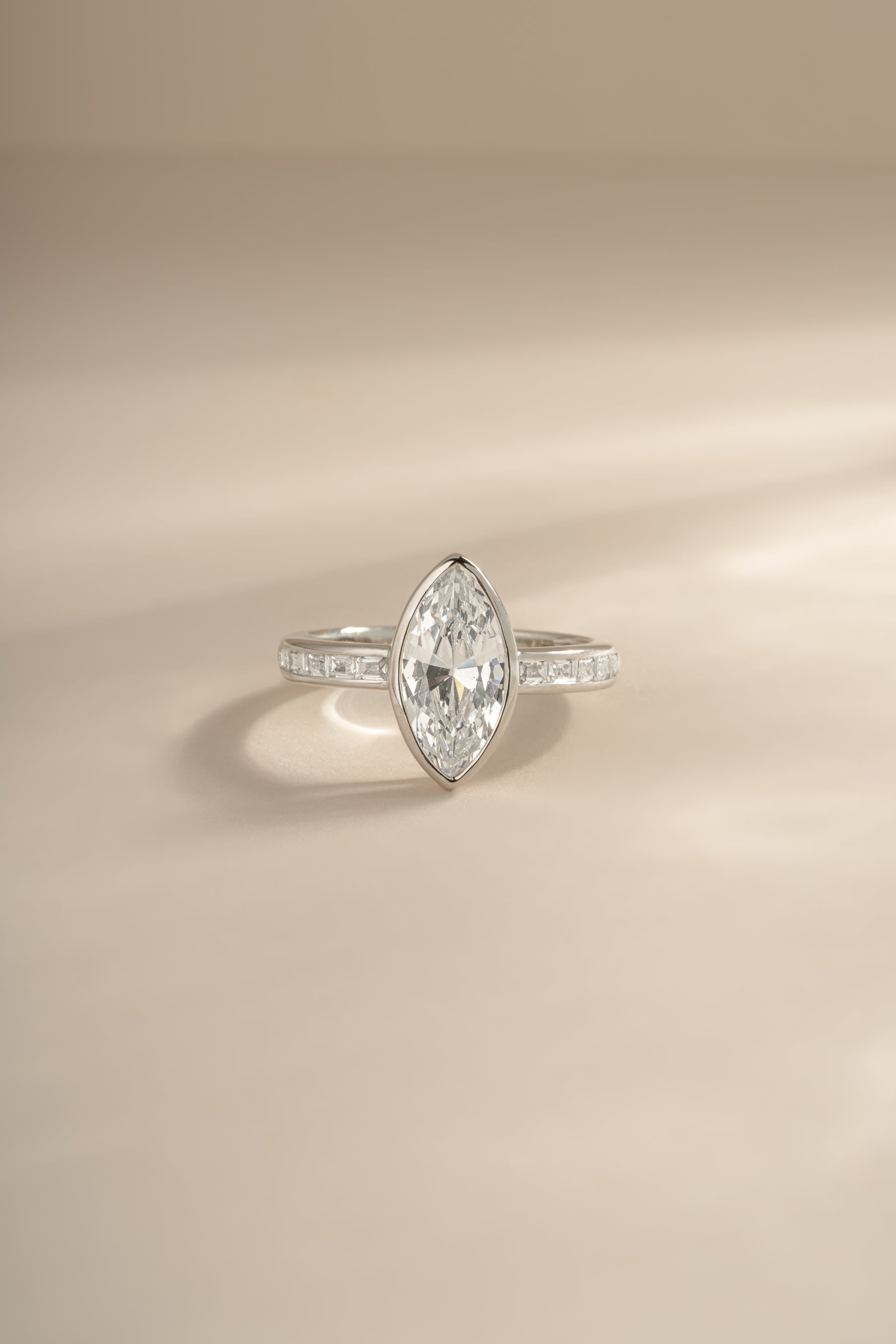 Sterling silver Bezel Marquise Ring with Baguette Band by Sami Jewels, featuring a marquise-shaped gemstone and sleek band design.