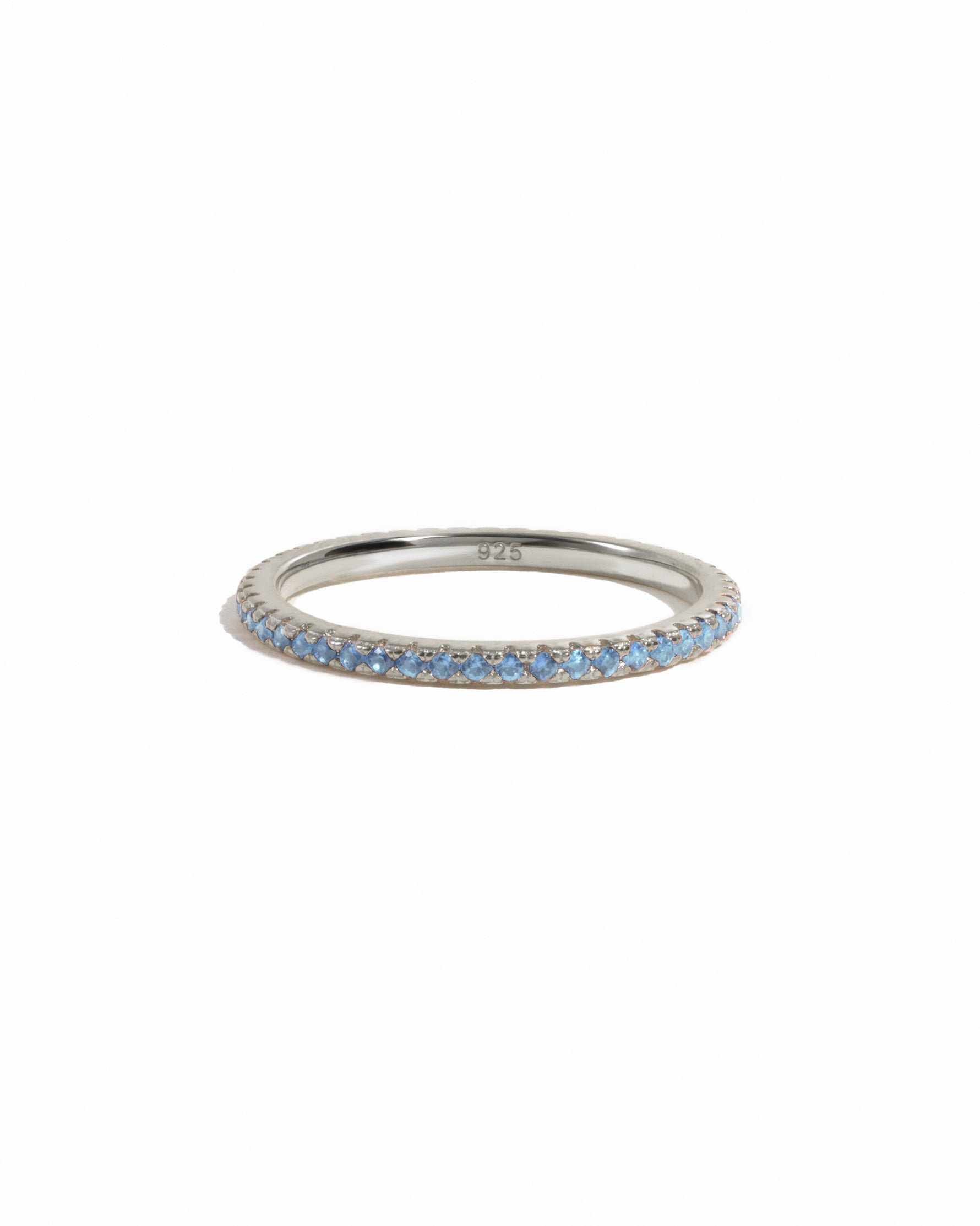 sterling silver blue topaz eternity ring white background