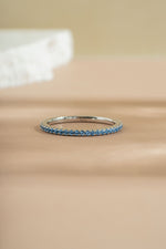 sterling silver blue topaz eternity ring closeup