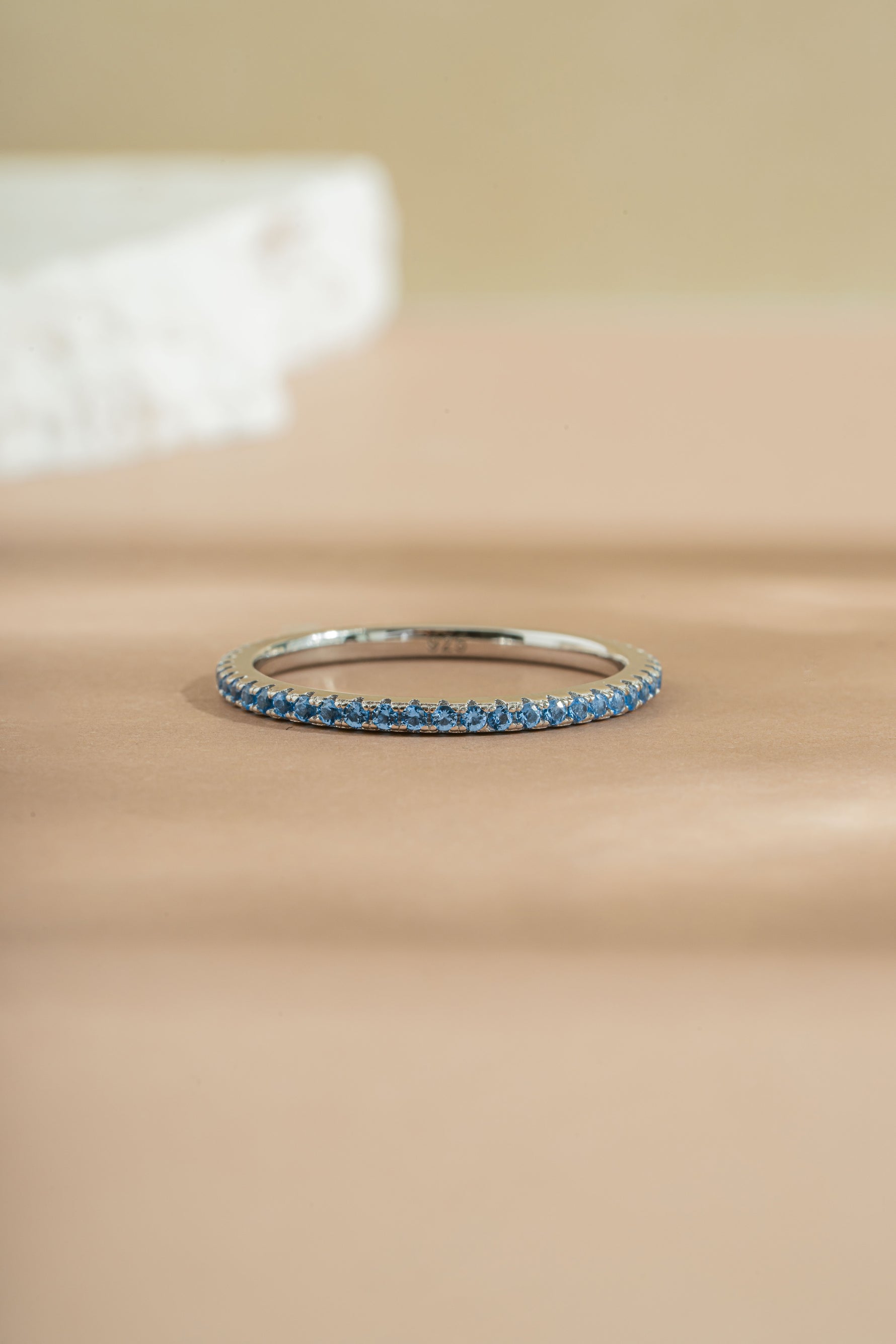 sterling silver blue topaz eternity ring closeup