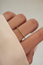 sterling silver citrine birthstone eternity ring on womens hand