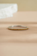 sterling silver gold citrine birthstone eternity ring neutral background