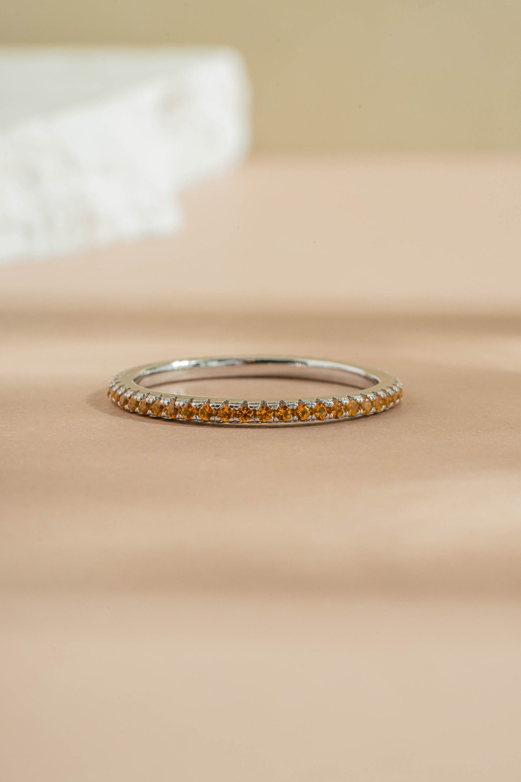 sterling silver gold citrine birthstone eternity ring neutral background