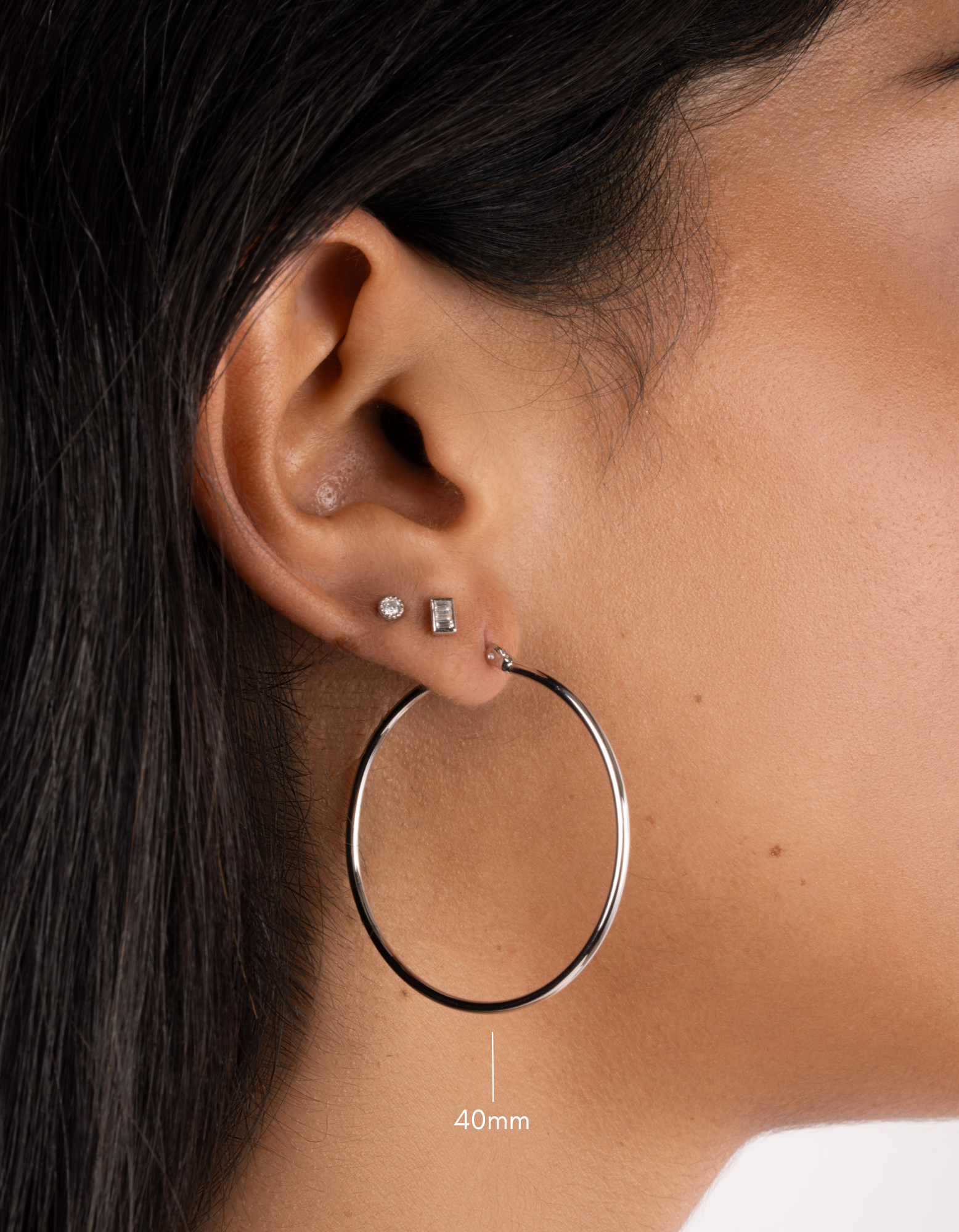 sterling silver classic hoop earrings on model in 40mm size