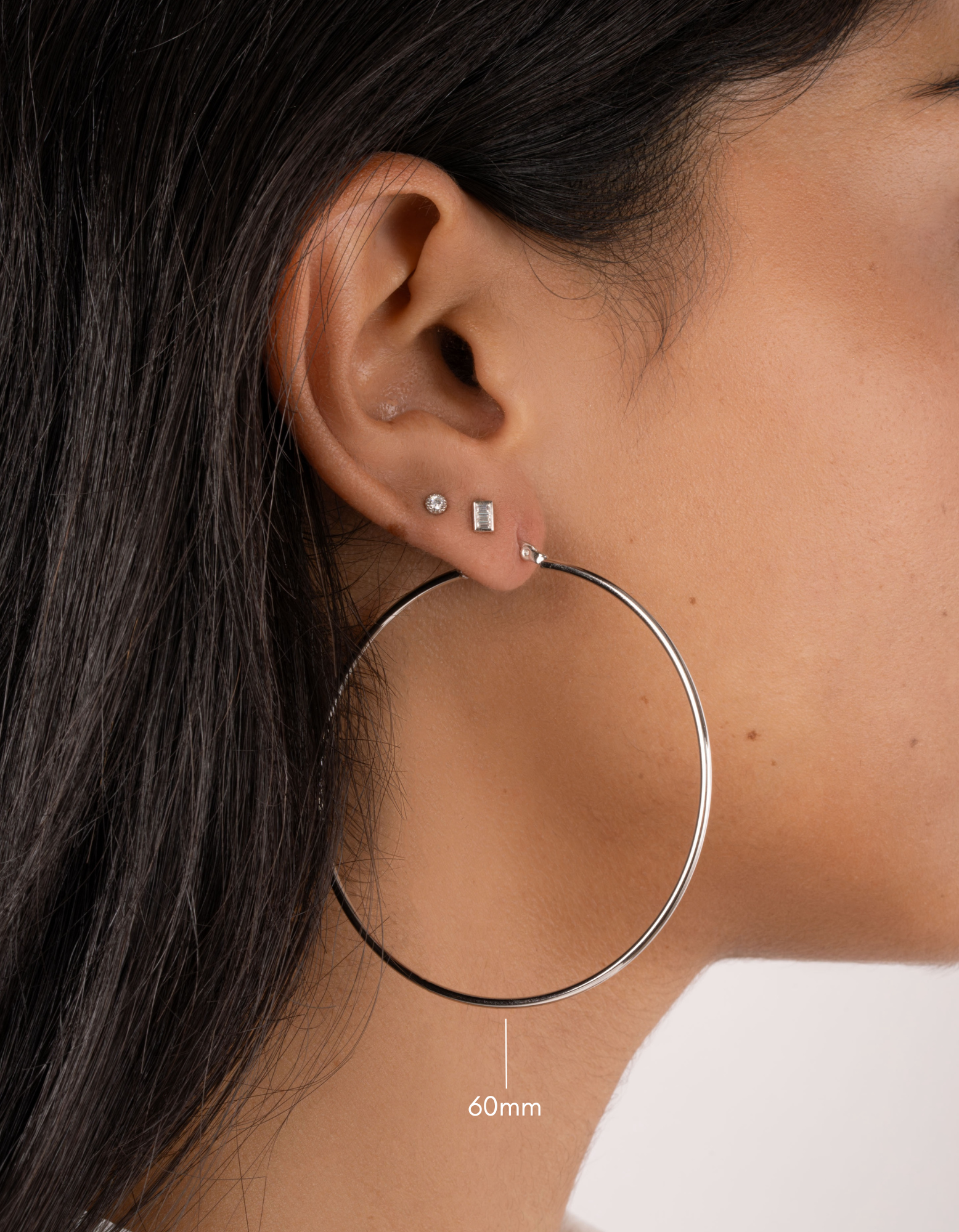 sterling silver classic hoop earrings on model in 60mm size