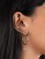 sterling silver classic hoop earrings on model in 30mm size