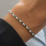 model wearing silver emerald tennis bracelet