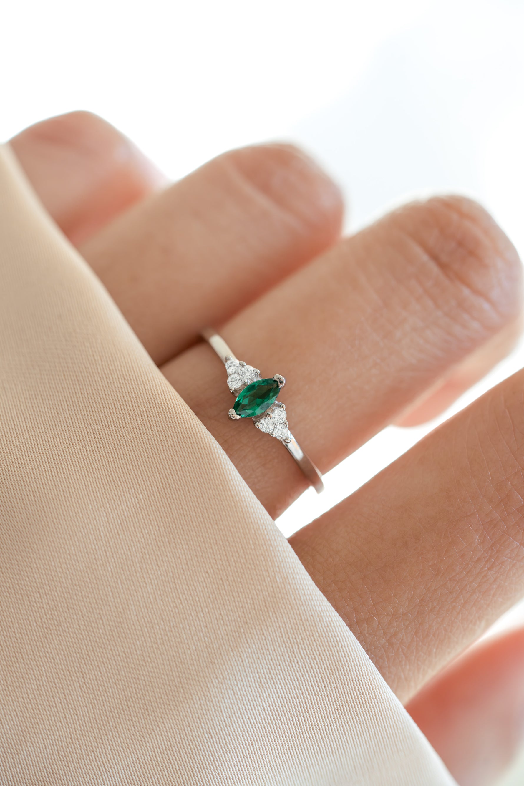 sterling silver diamond emerald marquise ring on women hand