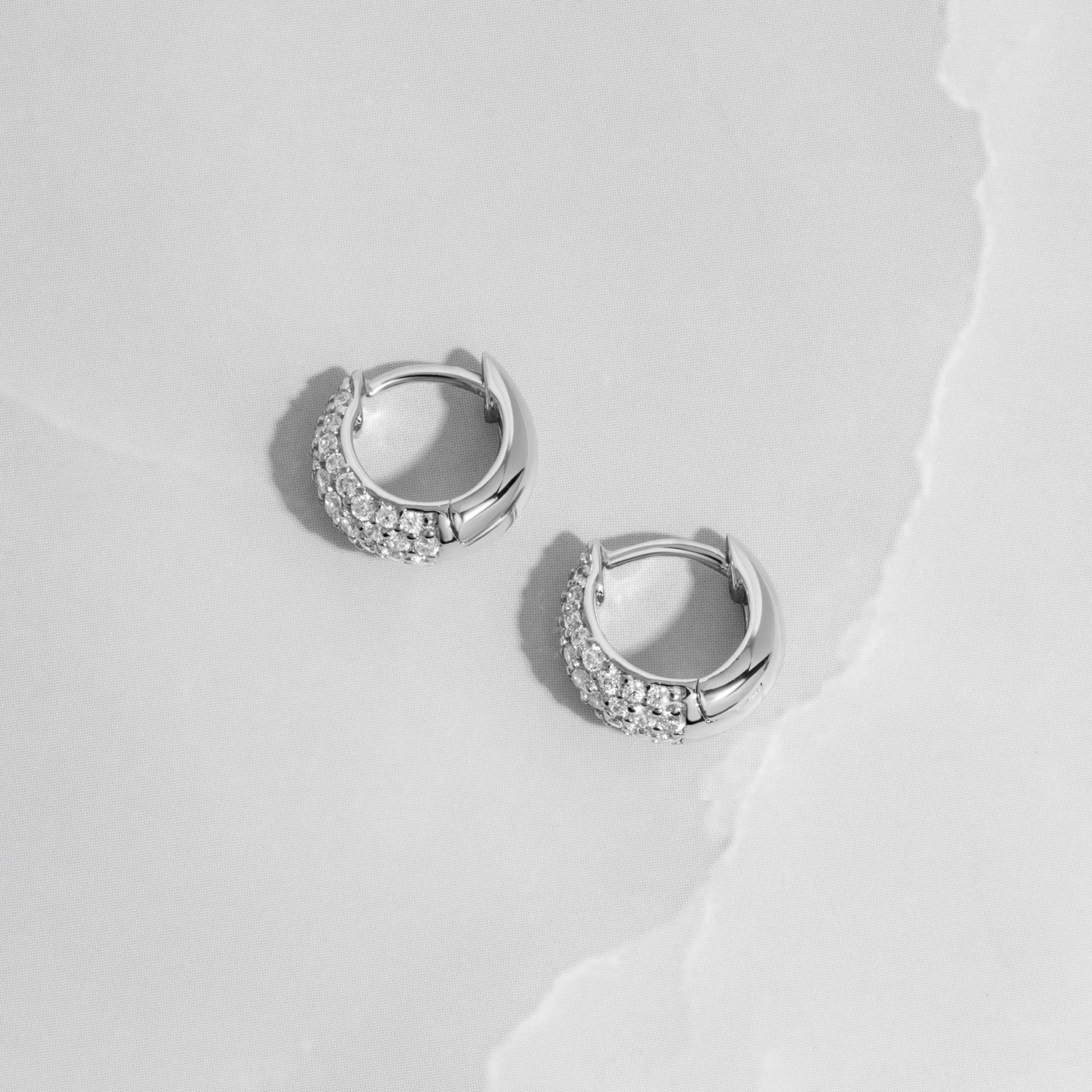 Sterling Silver Hinged Huggie Hoop Earirngs on white background