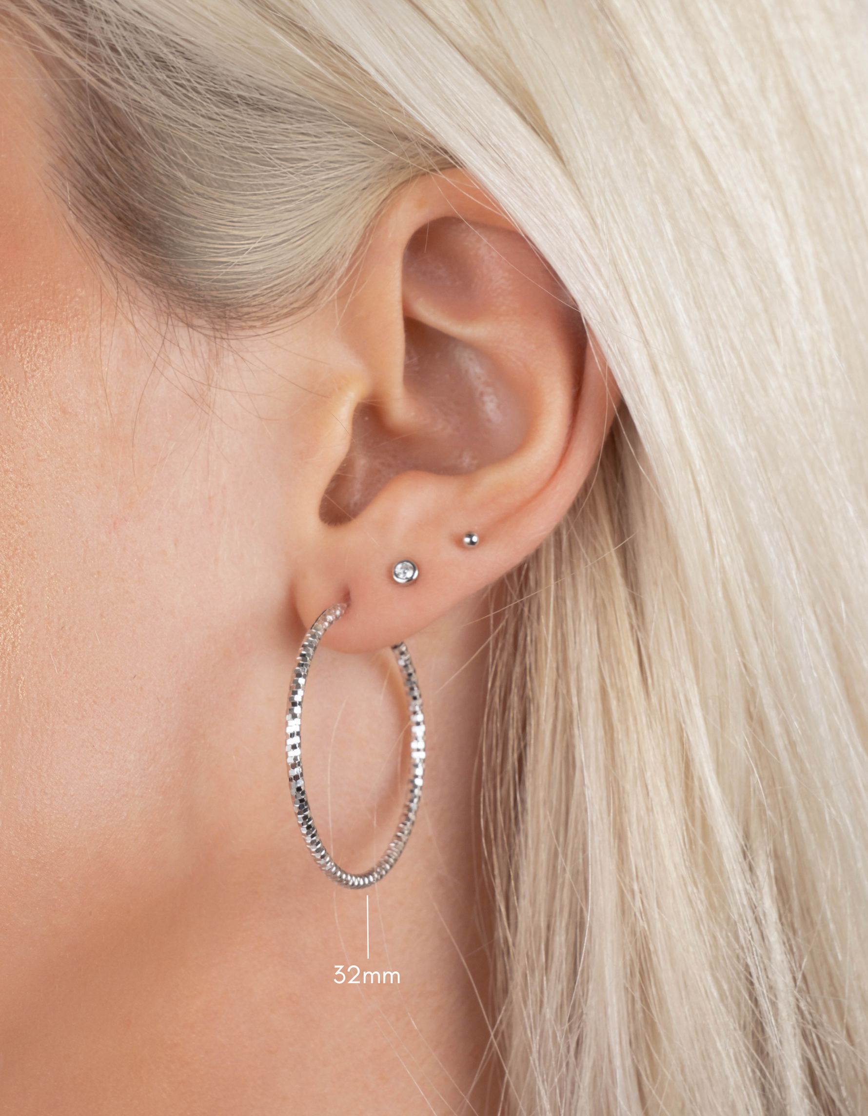 sterling silver hoop earrings in 32mm size on model 
