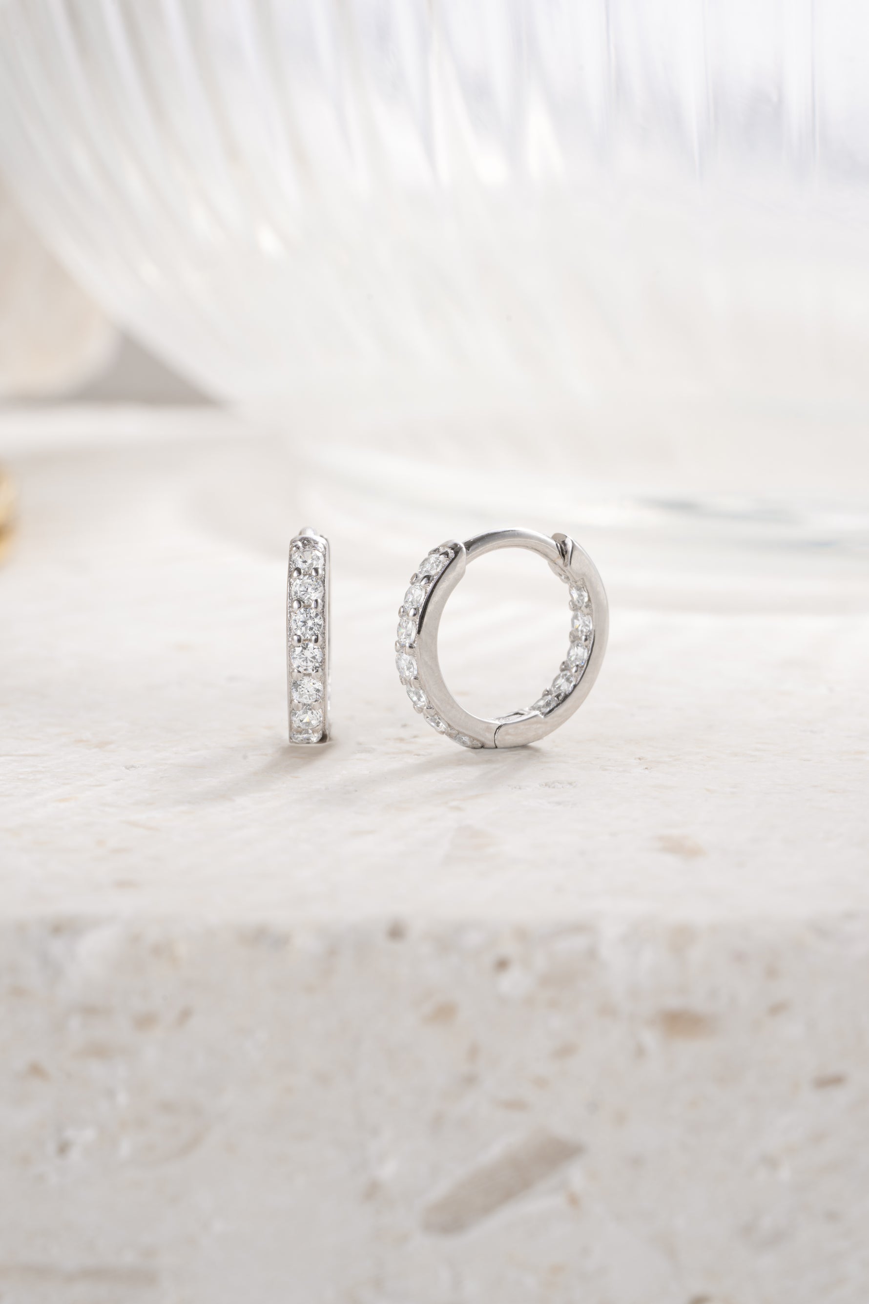 sterling silver 9mm studded huggie earrings angled view