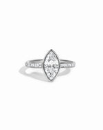 Sterling silver Bezel Marquise Ring with baguette band by Sami Jewels, featuring a marquise-shaped center stone and sleek band design.