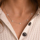 Model wearing sterling silver necklace with opal pendants on dainty 925 silver chain