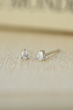 sterling silver 2x3mm pear stud earring on neutral background