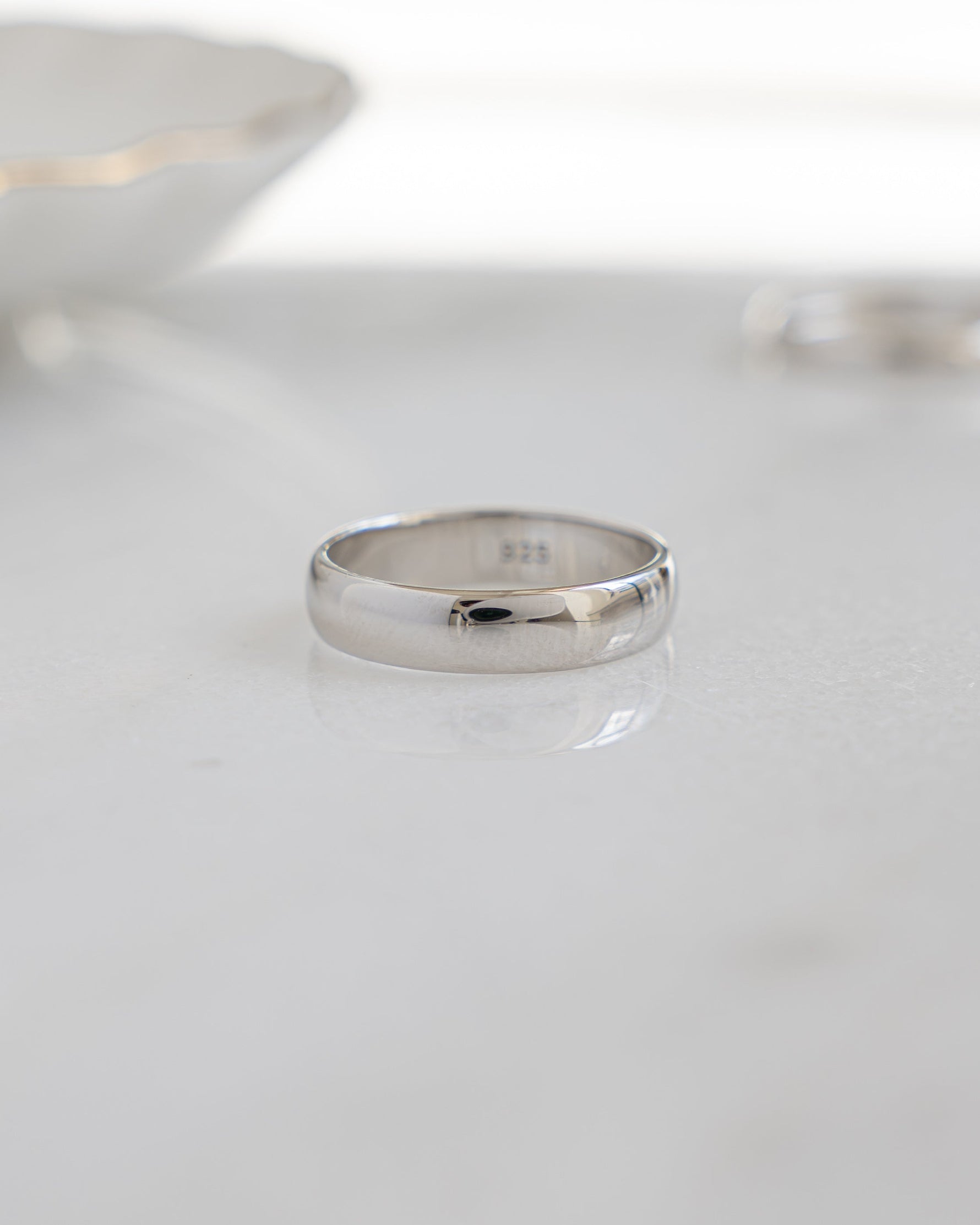 Sterling silver 5mm plain band ring by Sami Jewels with smooth, polished finish and classic design.