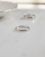 Sterling silver 3mm plain band ring by Sami Jewels with a smooth, polished surface and classic round shape.