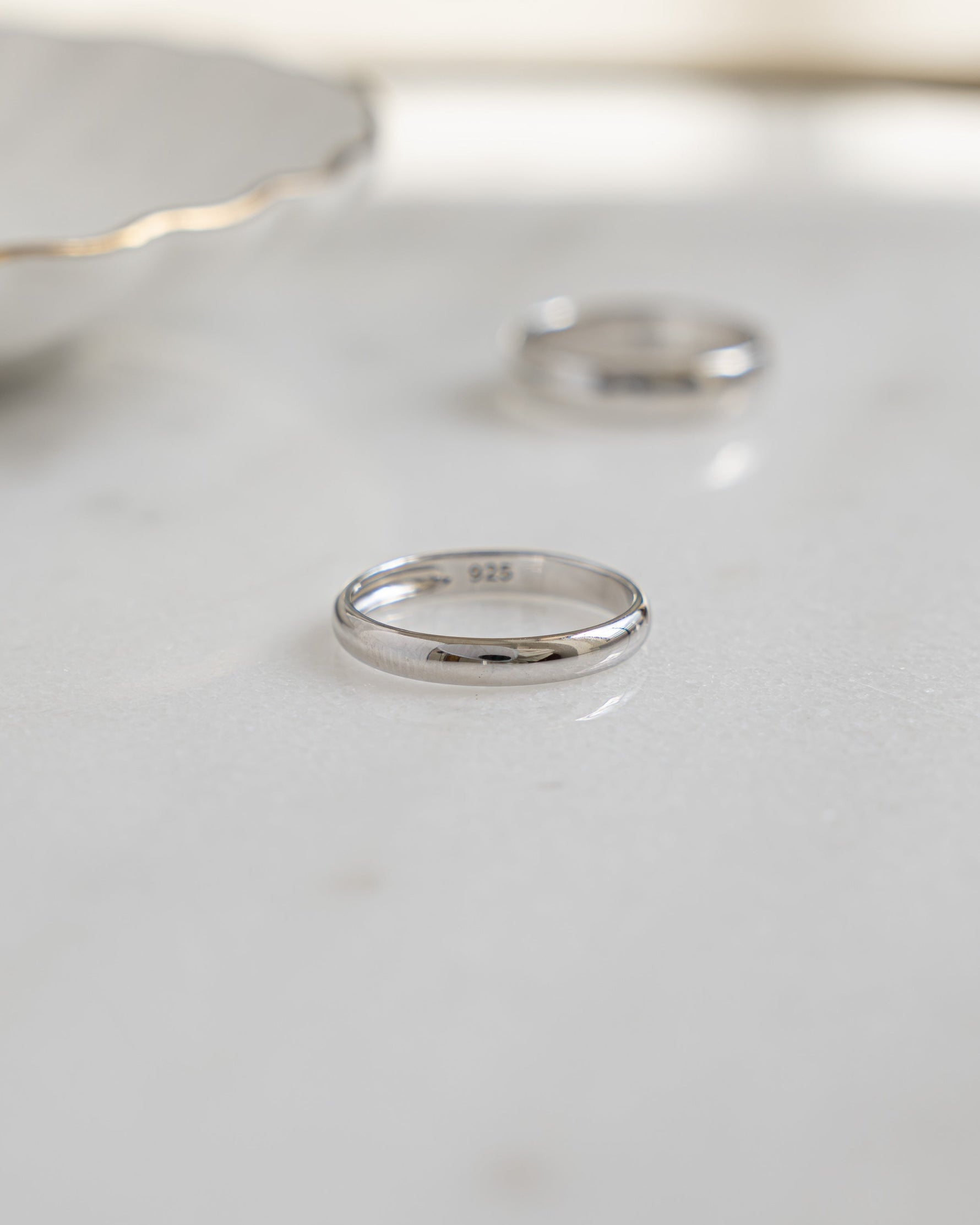Sterling silver 3mm plain band ring by Sami Jewels with a smooth, polished surface and classic round shape.