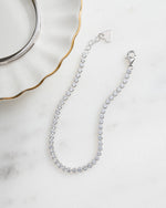 sterling silver diamond round tennis bracelet neutral background