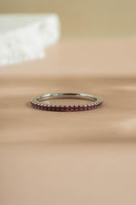 sterling ruby birthstone eternity ring neutral backgrond