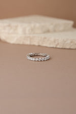 sterling silver studded eternity ring neutral background