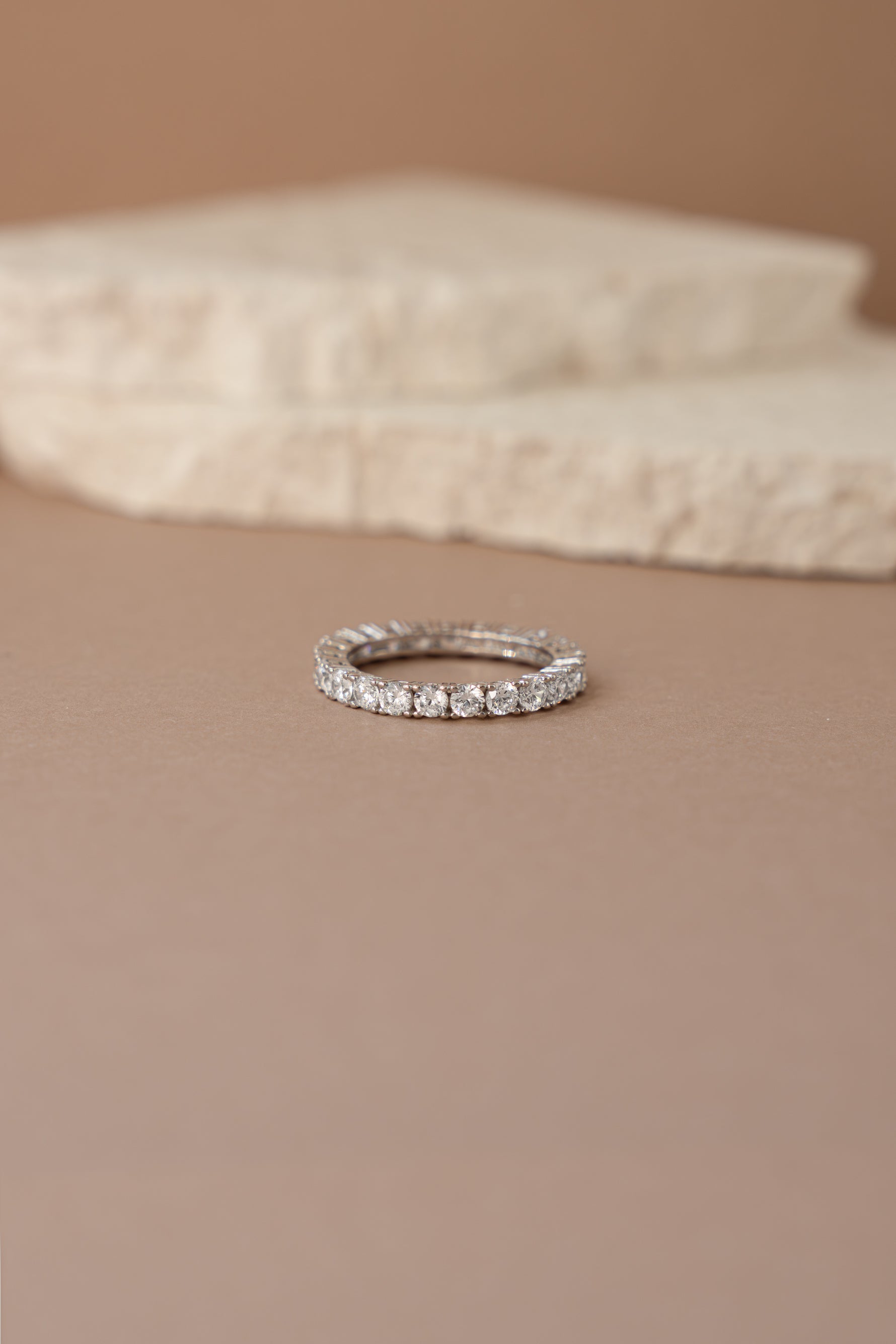 sterling silver studded eternity ring neutral background