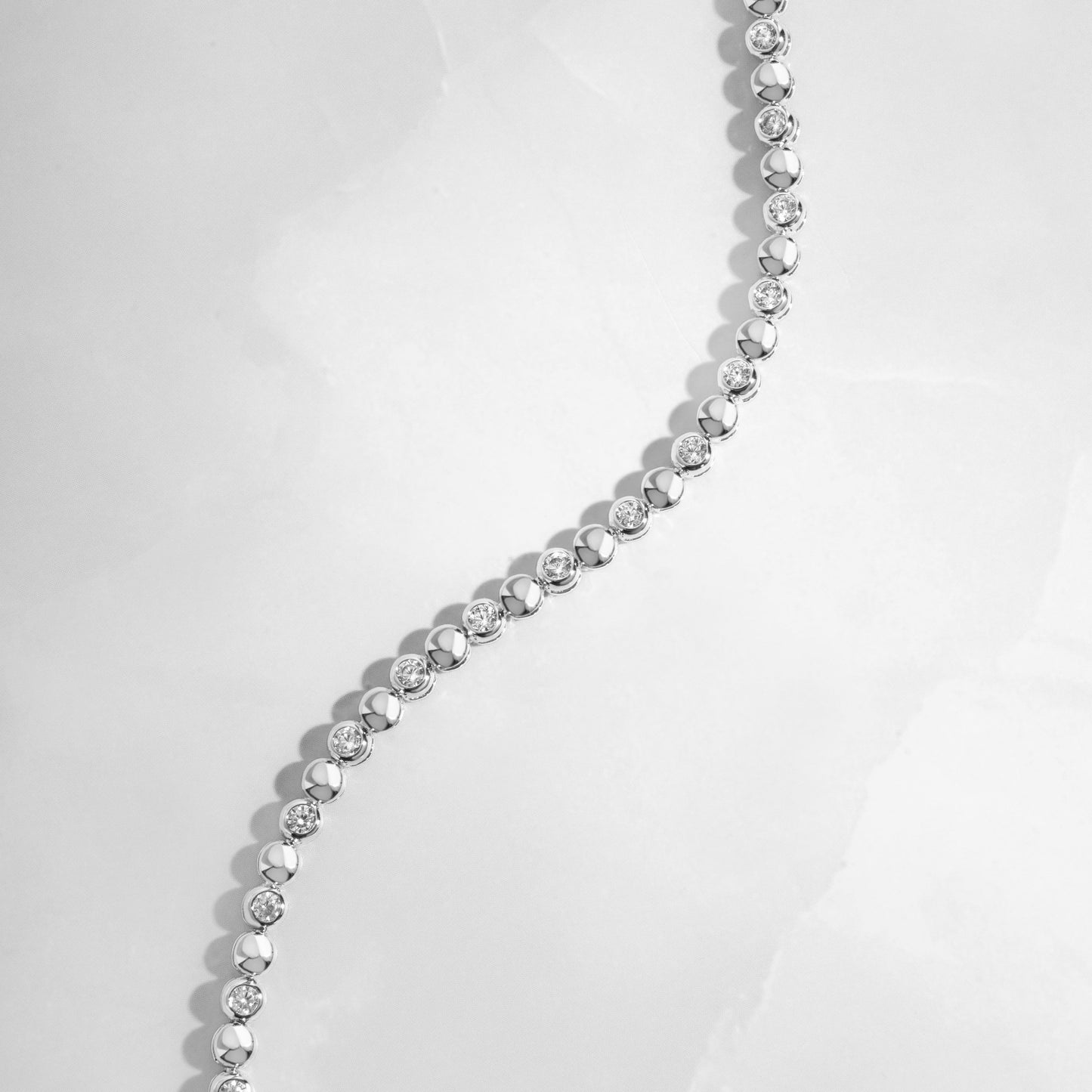 Sterling silver moissanite bezel bracelet on white background