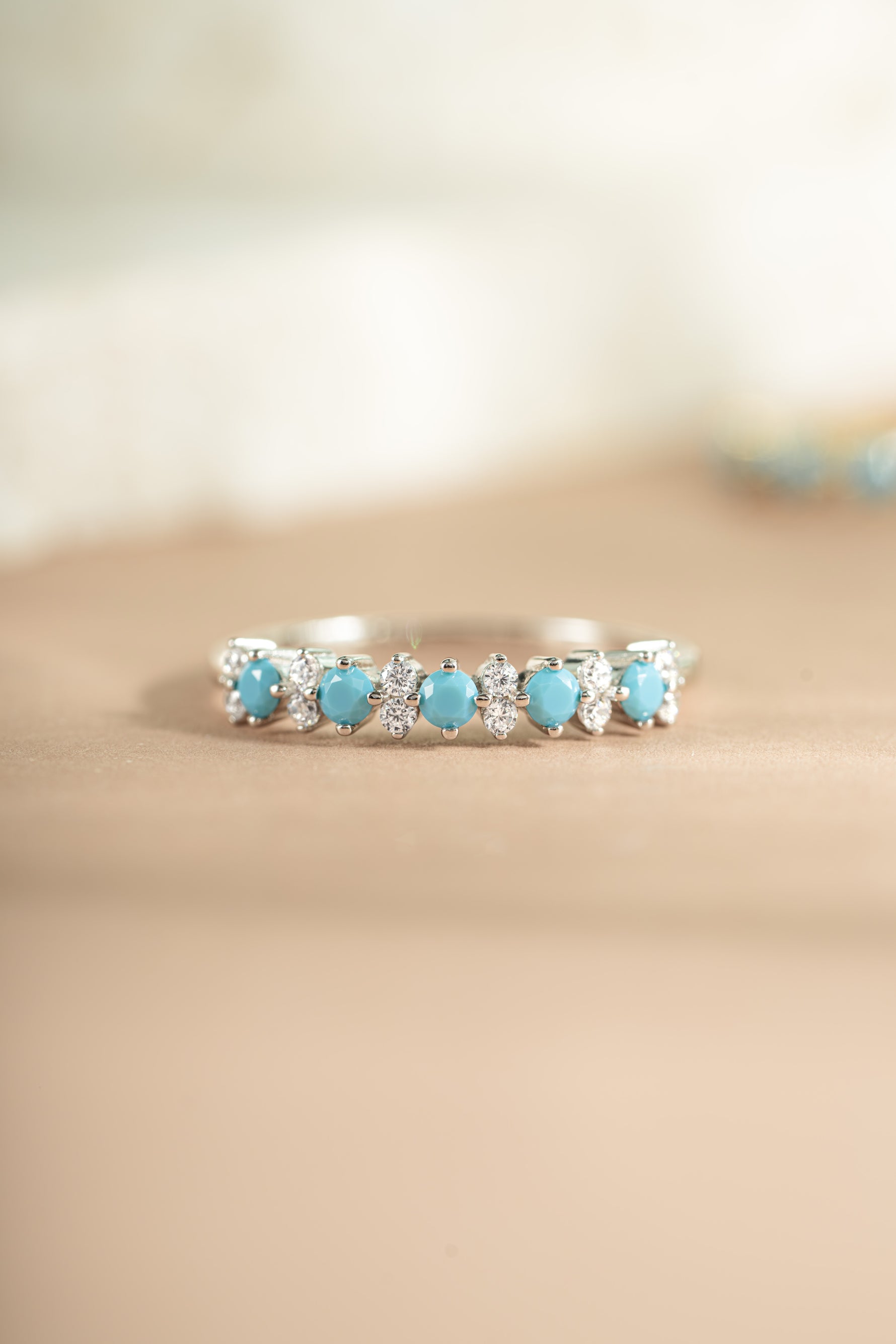 sterling silver turquoise and opal stacking ring neutral background