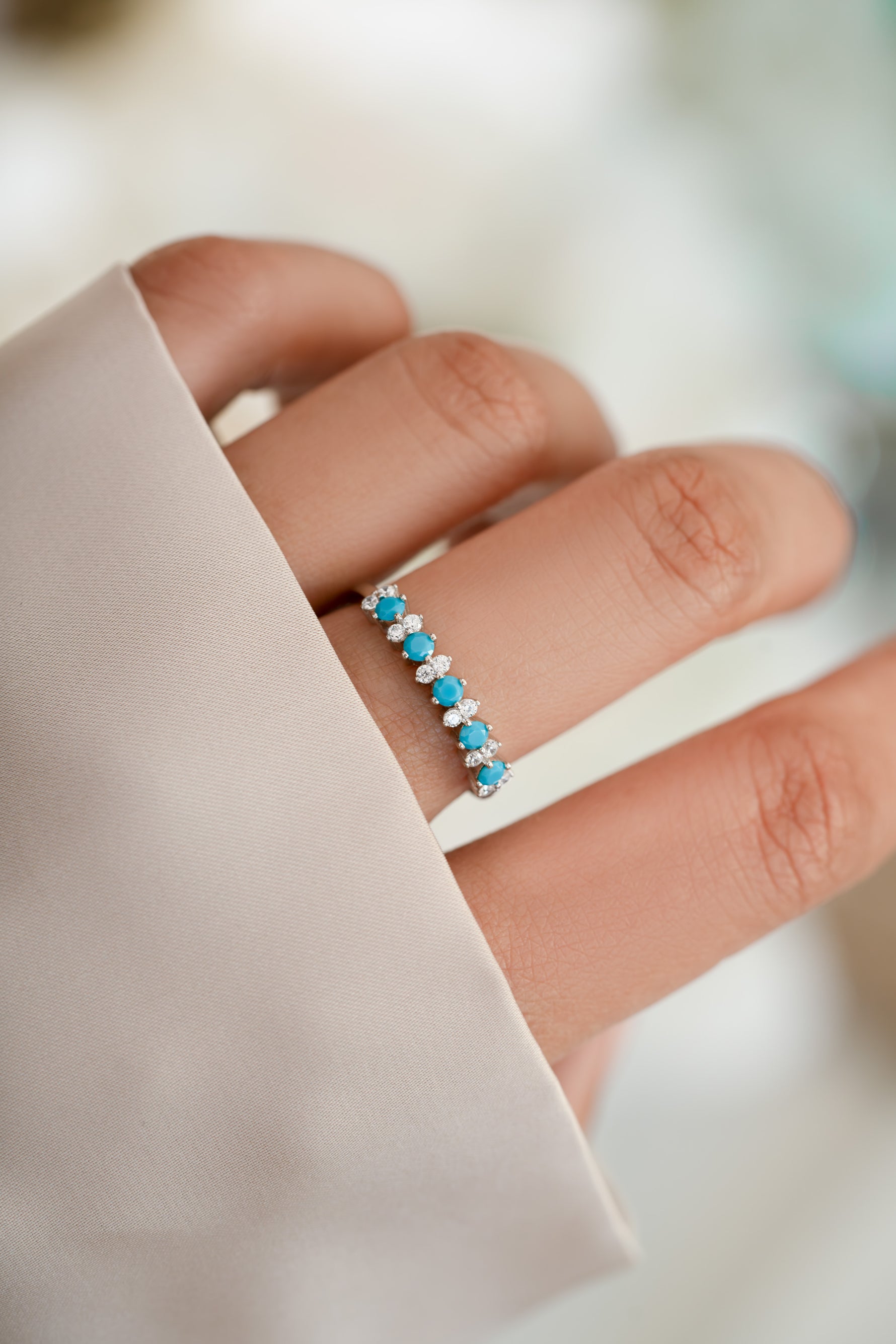 sterling silver turquoise and opal stacking ring on womens hand